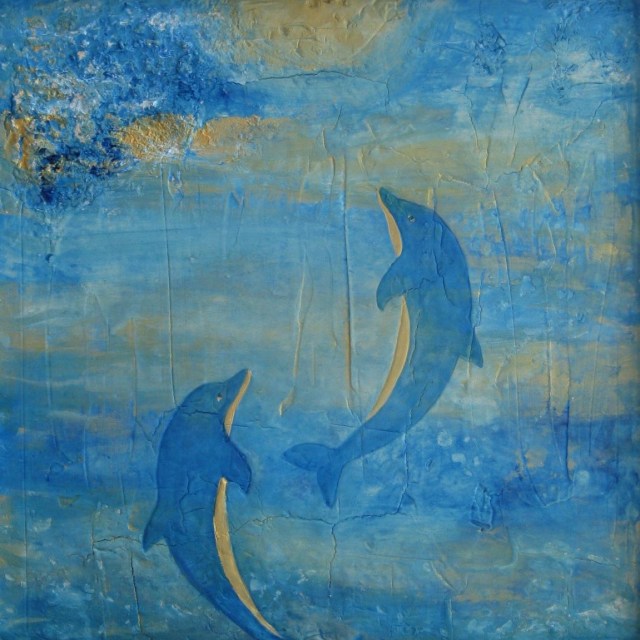 Dolphins swimming to light