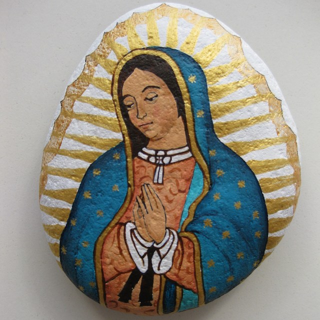 Our Lady of Guadalupe painted on stones.