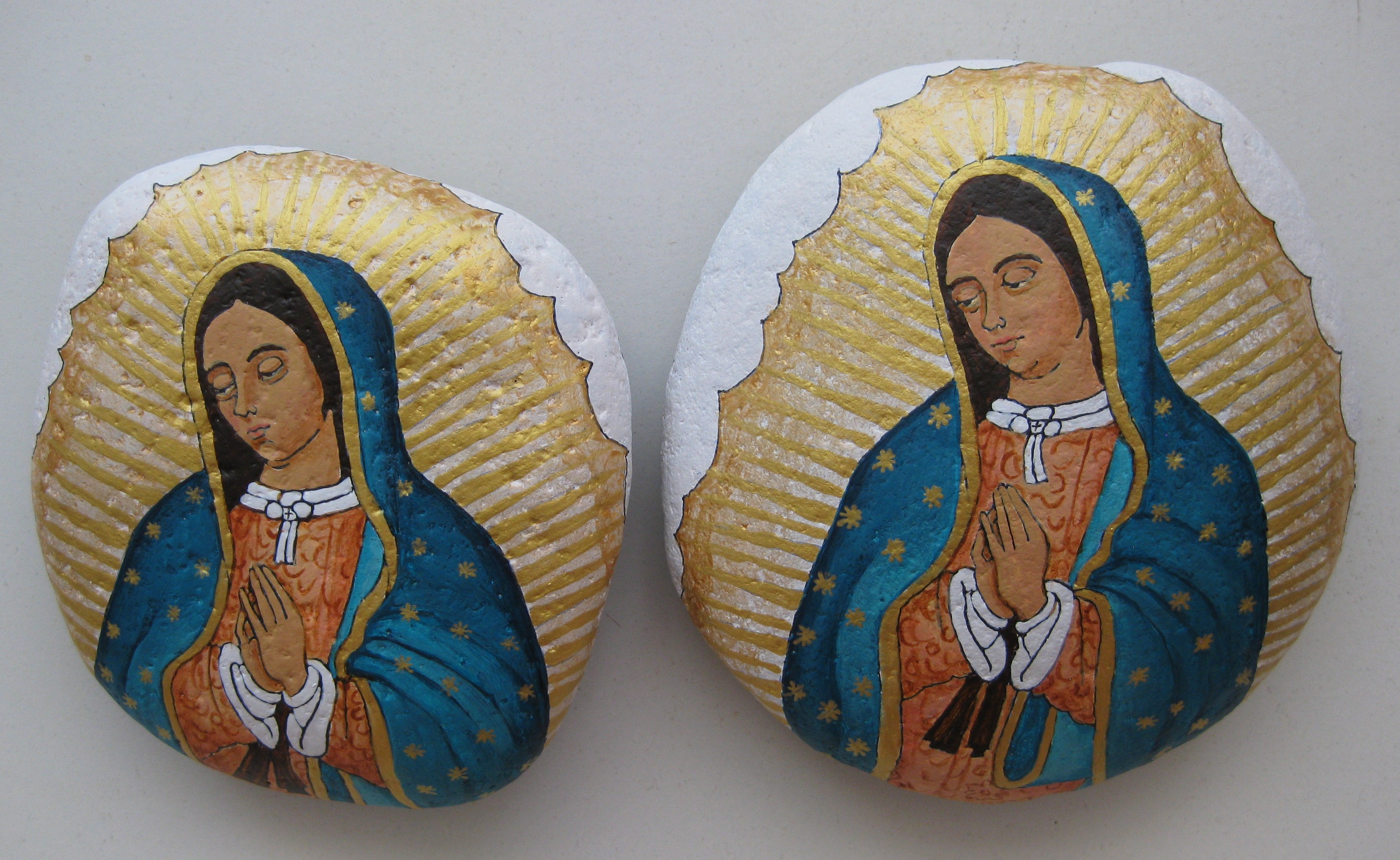 Our Lady of Guadalupe painted on stones.
